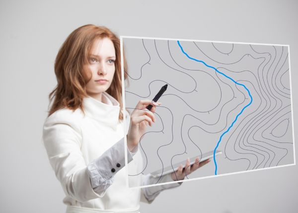 Professional woman mapping something digitally.